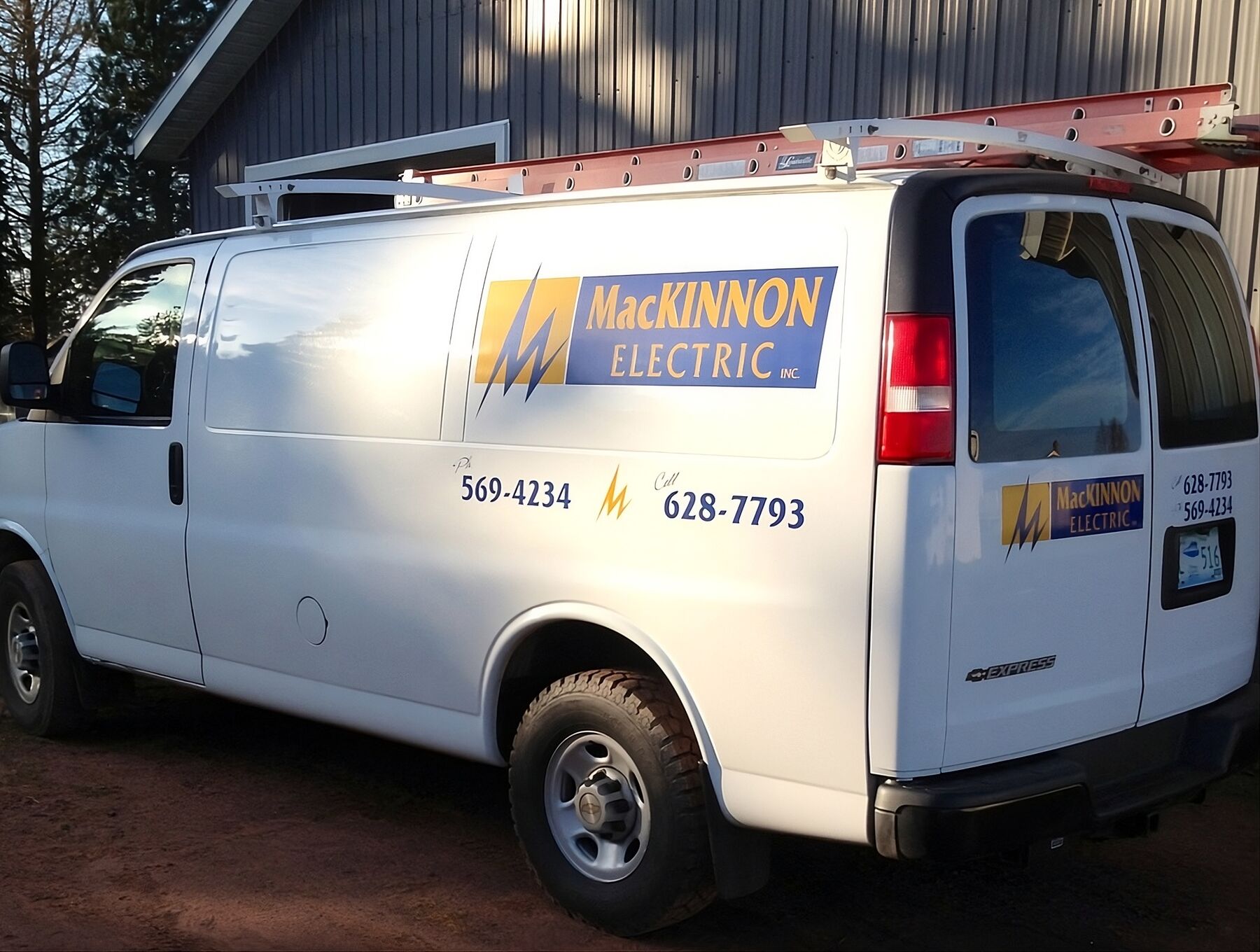 MacKinnon Electric service van with ladder racks outside the shop in Mt Herbert, PEI